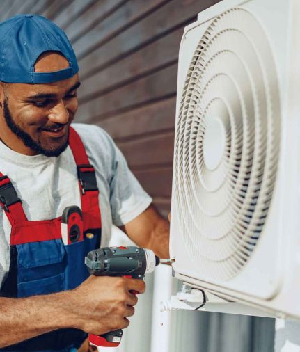 a technician fastening screws on HVAC